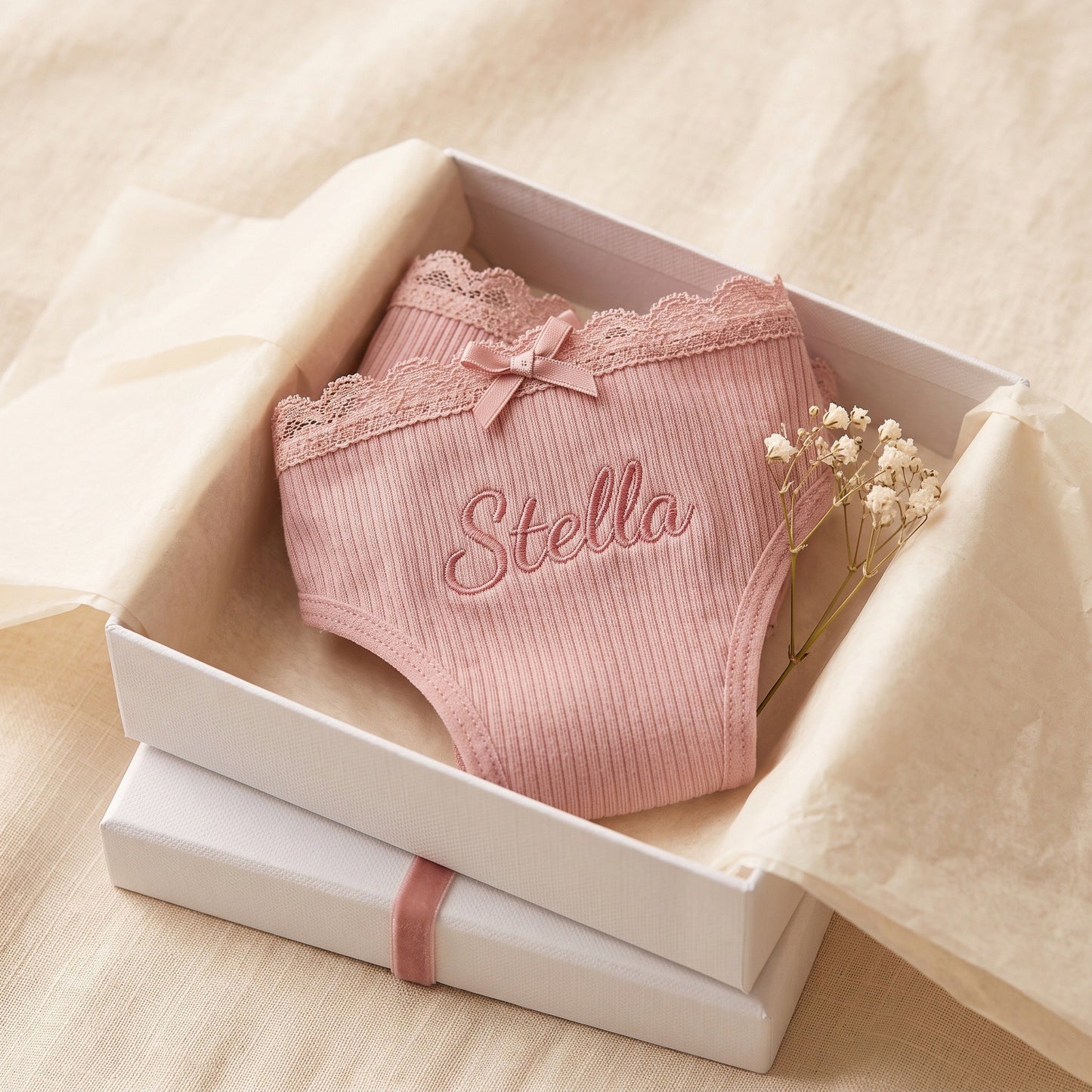 Personalised embroidered thong - Blush pink flat lay with pearl and lace props | SweetCarry